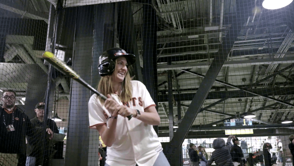 San Francisco Giants Fan hitting in the HitTrax Suite