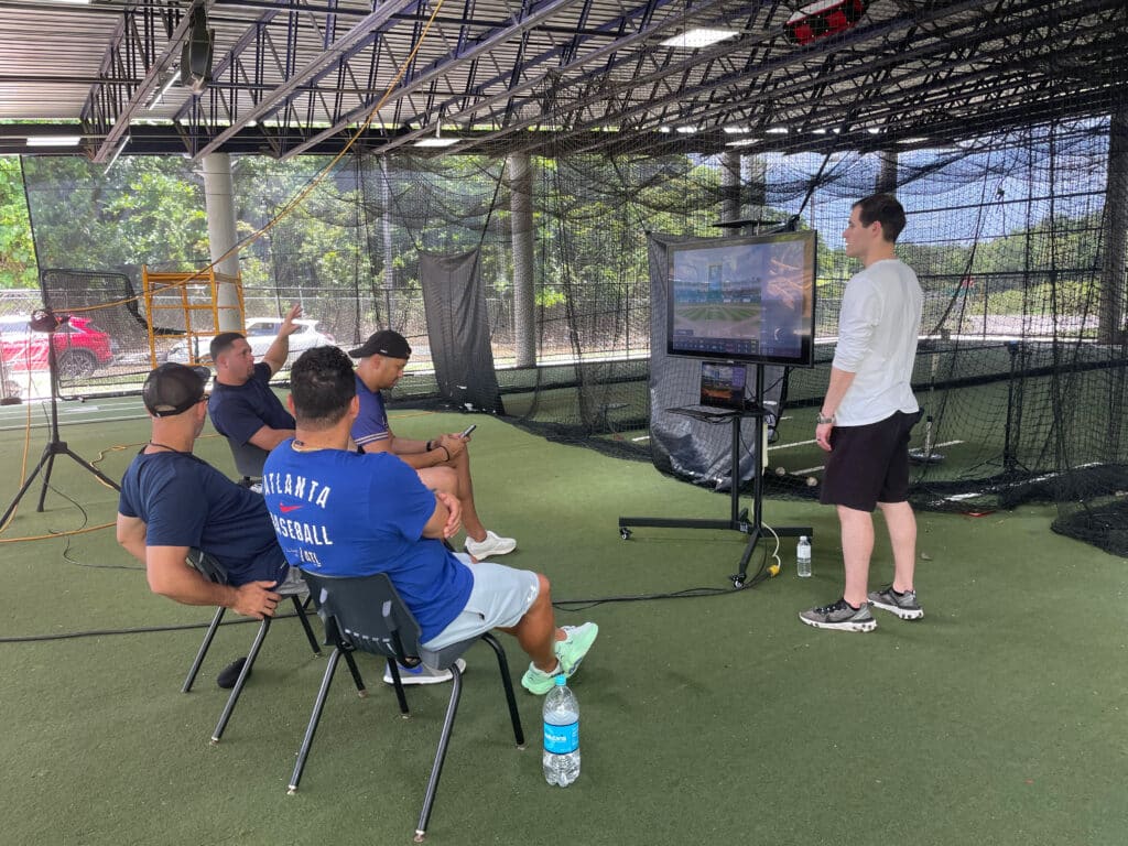 HitTrax showing coaches how to use the technology. 