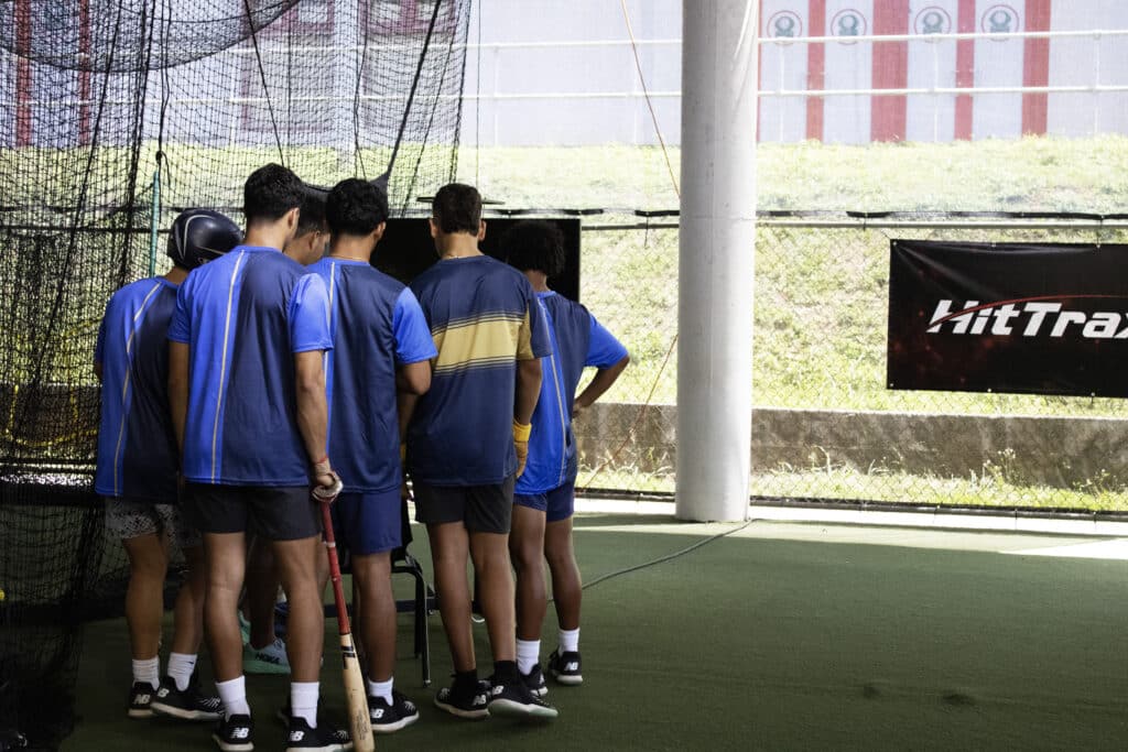 Carlos Beltran Baseball Academy student-athletes checking out the HitTrax system. 